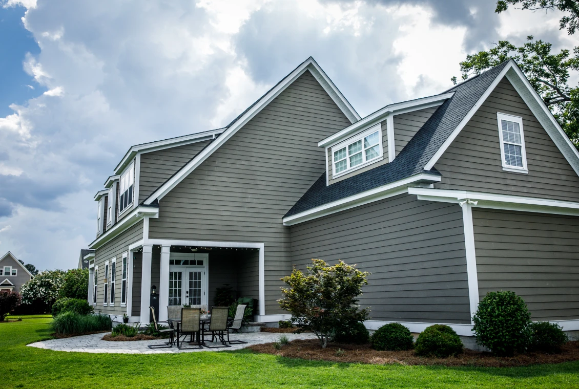 Modern suburban house under cloudy sky